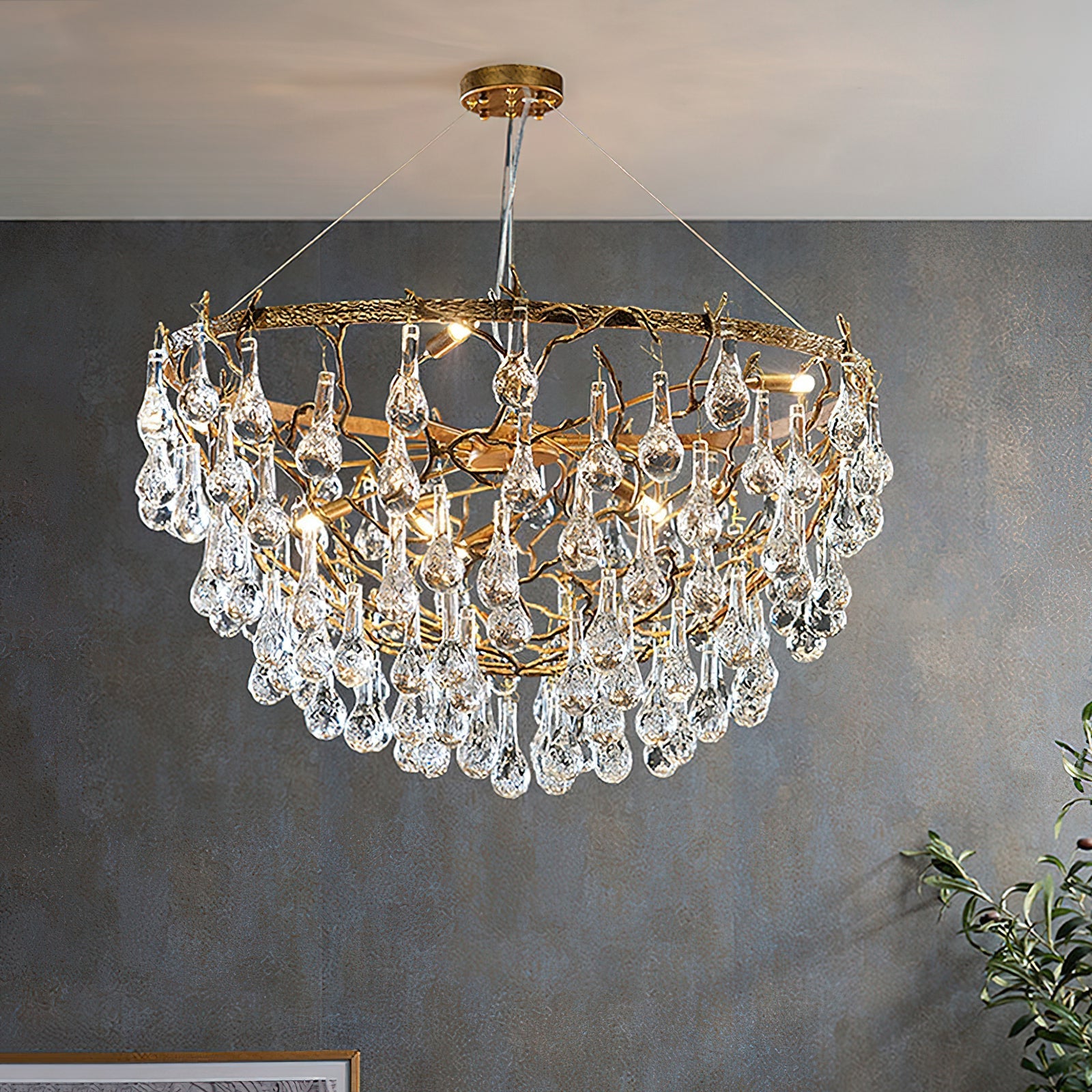 Close-up of the organic branch framework of the Doris Chandelier in antique brass.