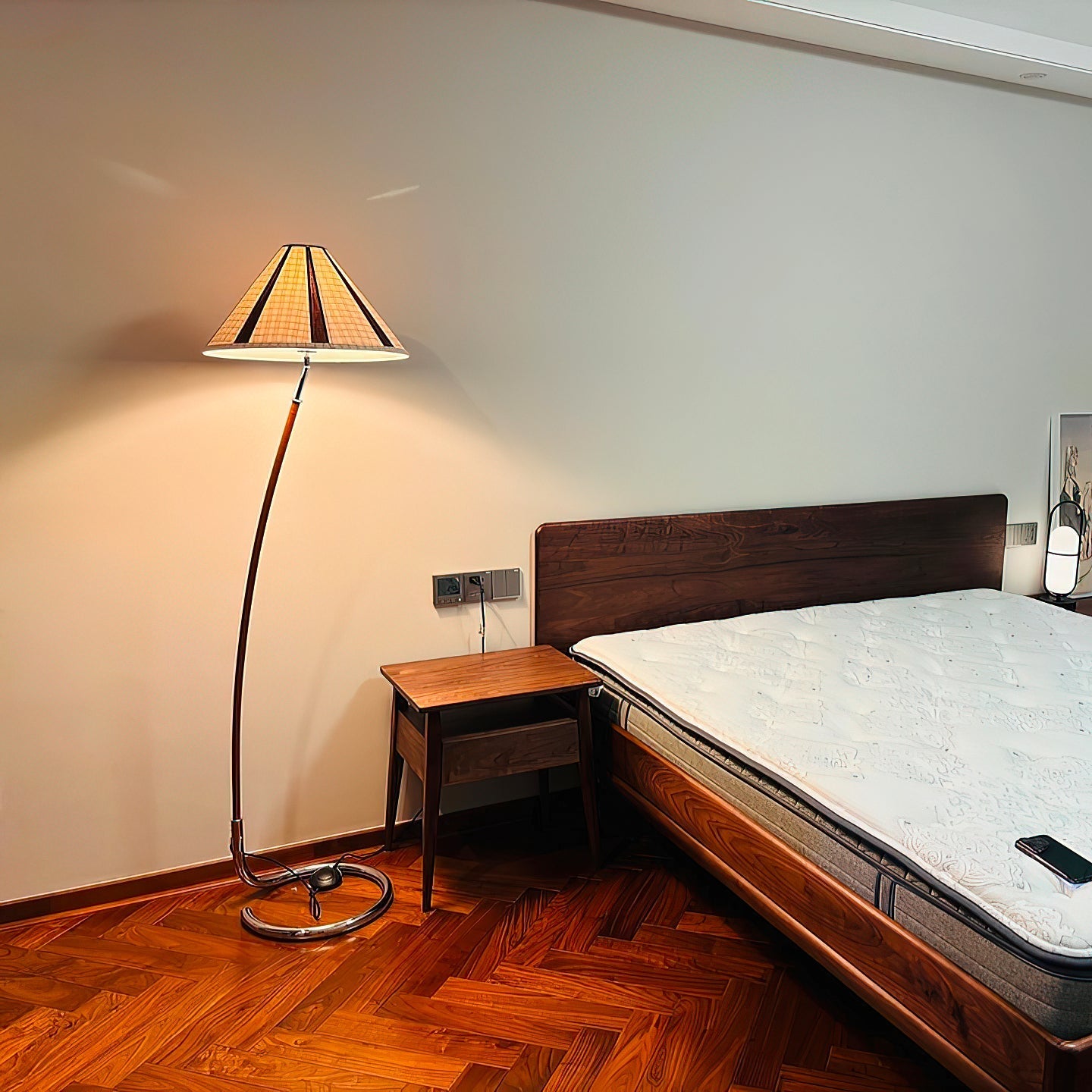 The lamp turned on, casting a warm and diffuse light in a dark room.