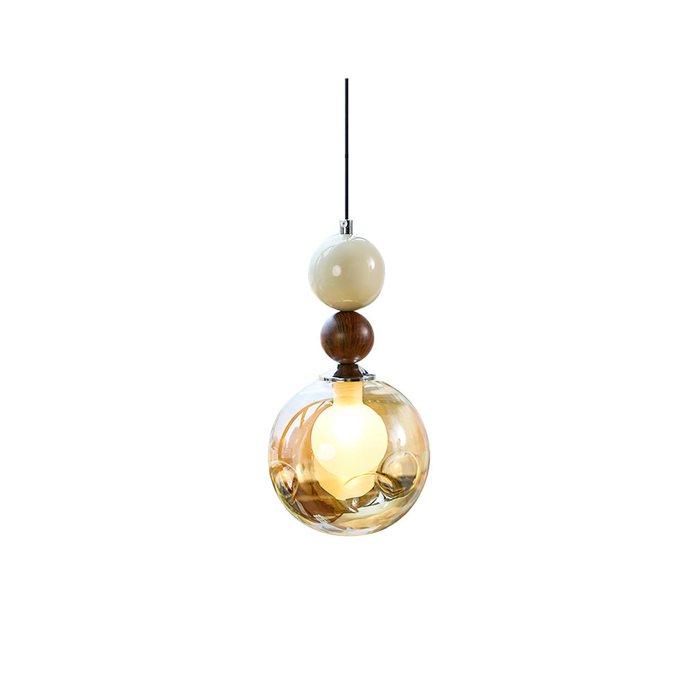 Dot Pendant Light with cognac glass sphere and walnut accent.