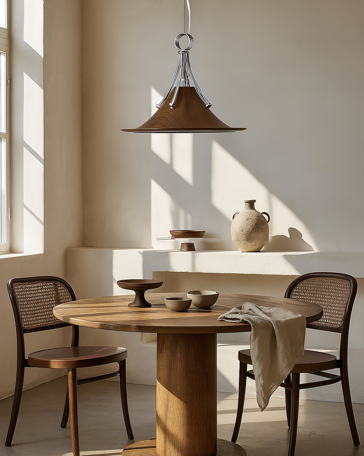 Angled view of the Walnut Dottie Pendant Light, highlighting its contoured shape.