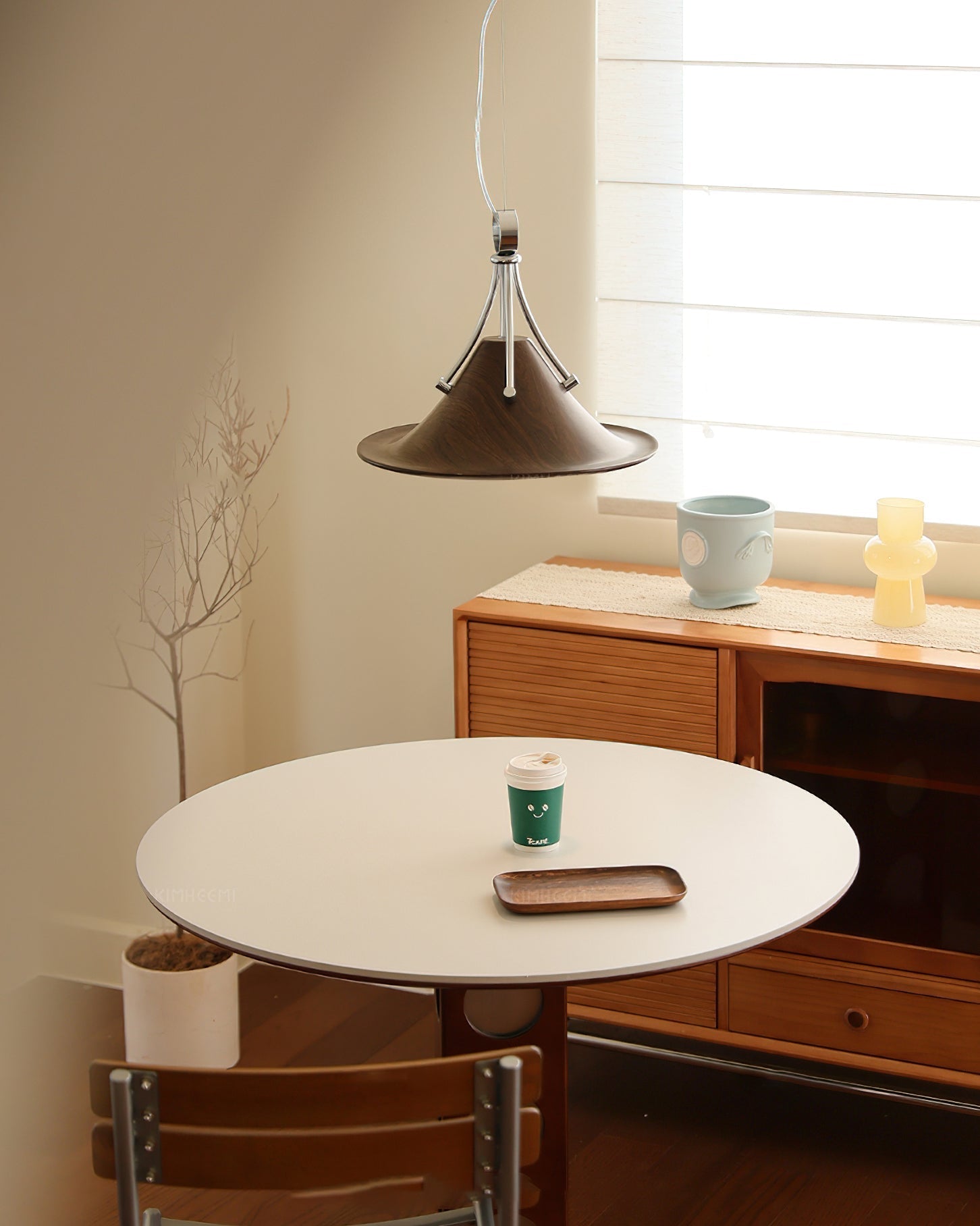 Dottie Pendant Light in Cream color, showcasing its sleek profile.