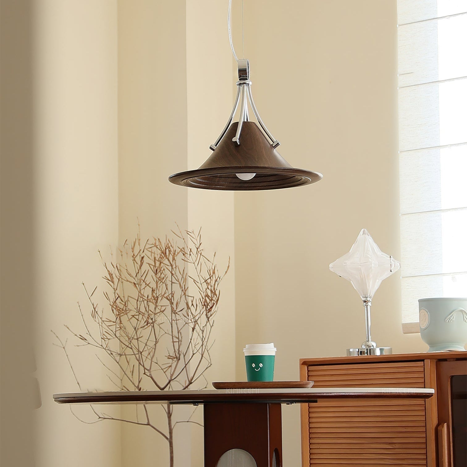 Close-up of the Dottie Pendant Light's wood-finish shade and chrome accent.