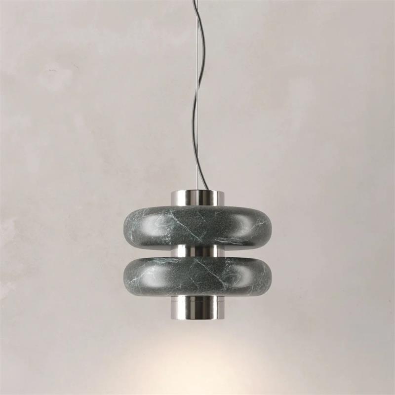 Lifestyle image of the Duo Marble Pendant Lamp over a dining table.
