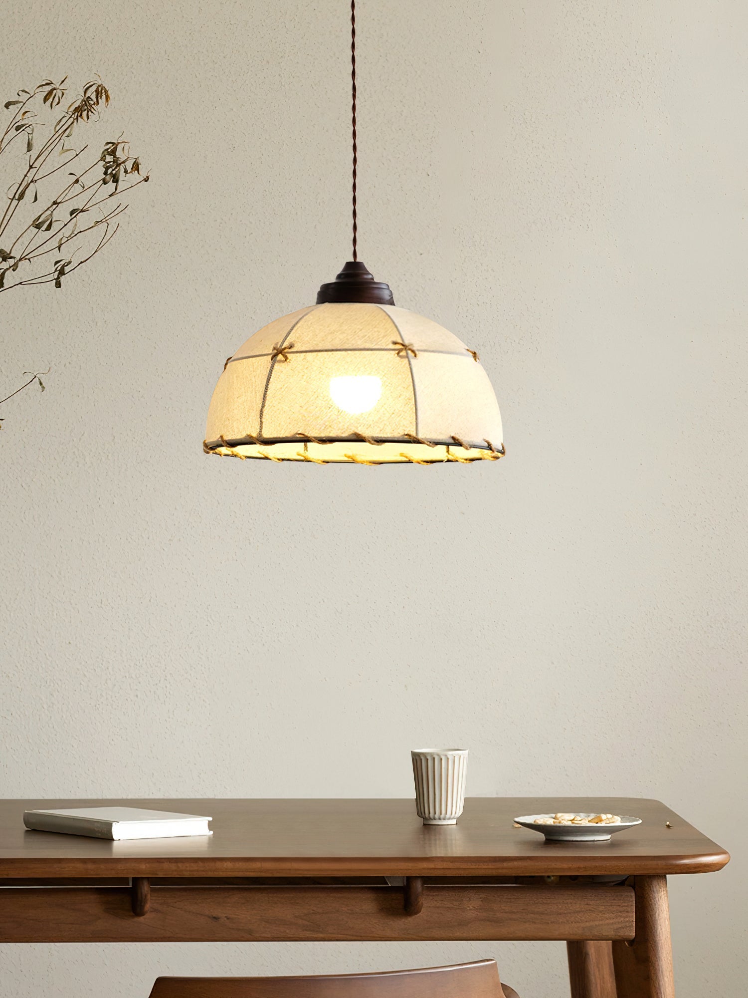 Linear Duomo Pendant Light with three beige fabric shades.