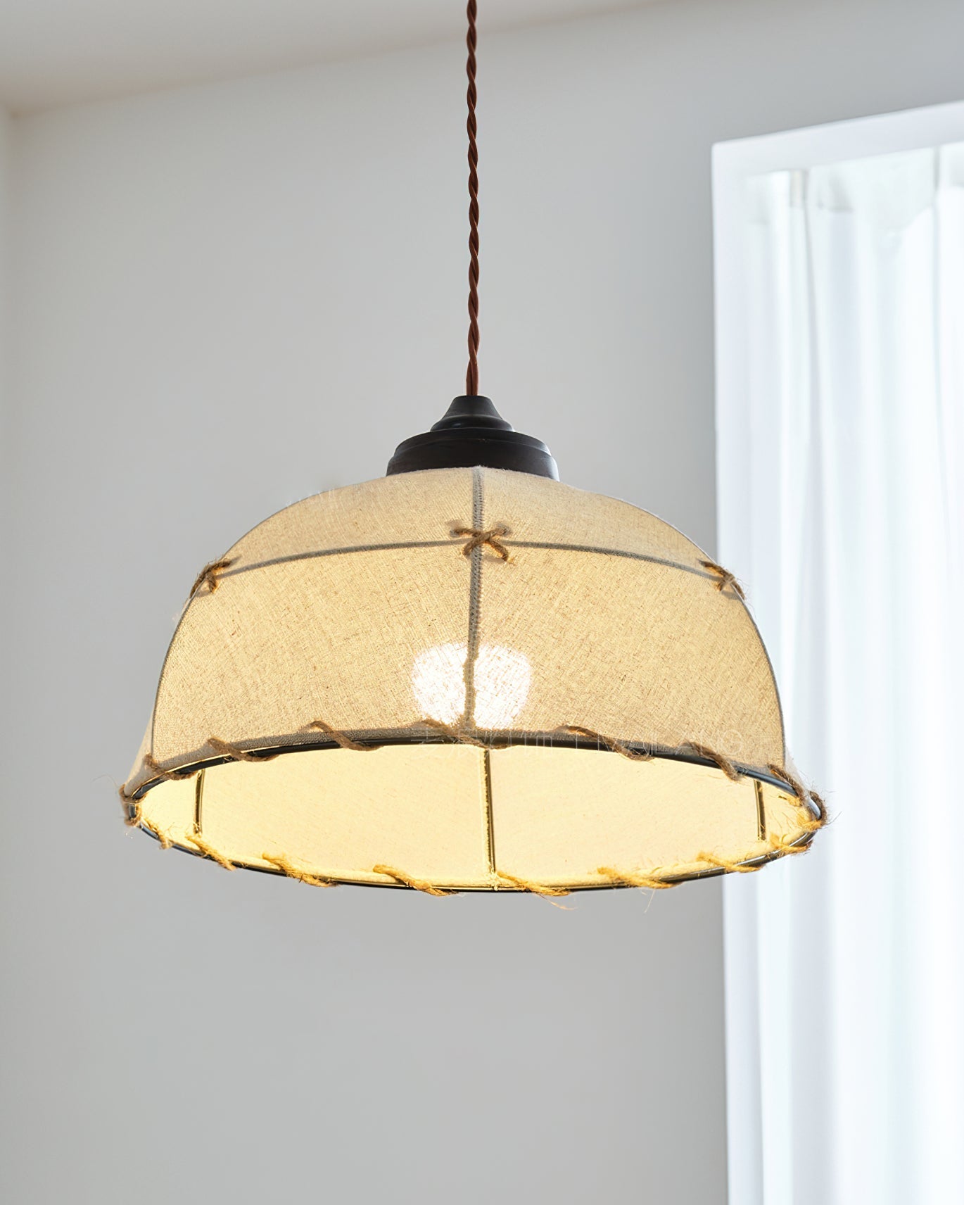 The three-light Duomo Pendant fixture in a spacious, contemporary room.
