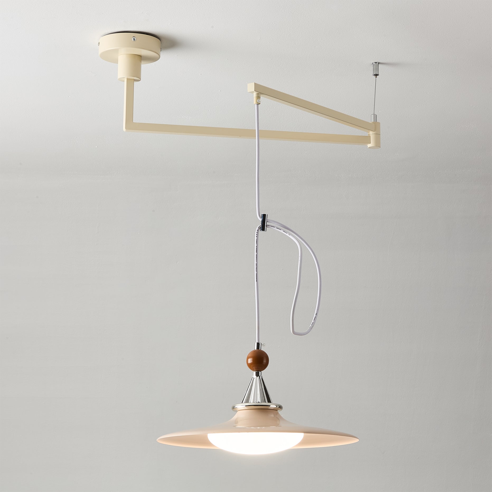 Eden pendant light hanging over a dining table.