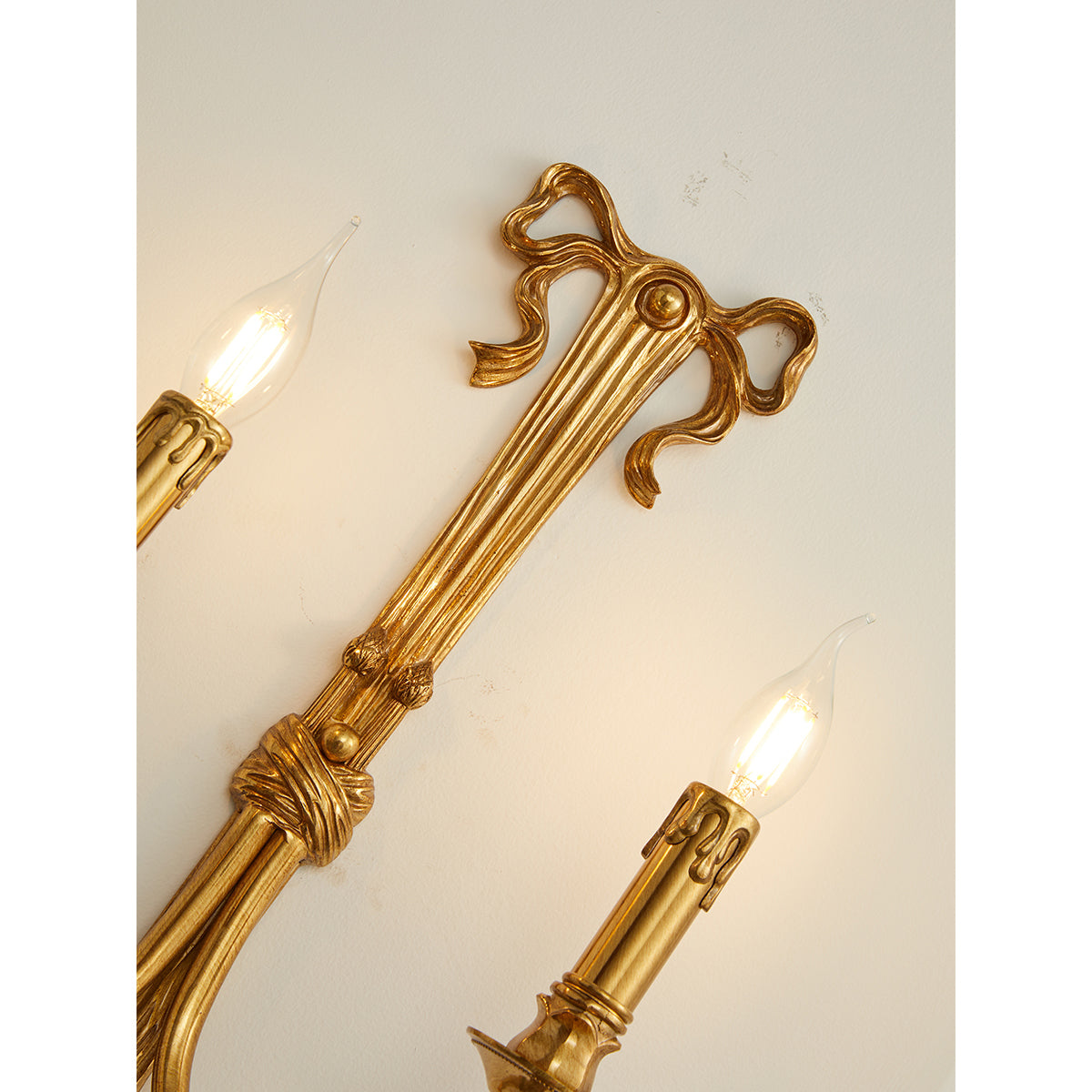 Edith Brass Wall Lamp shown from a low angle.
