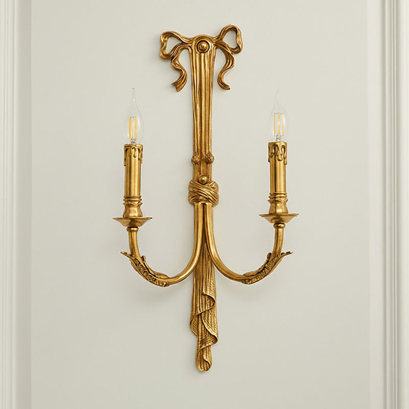 Lifestyle image featuring the Edith lamp over a side table.