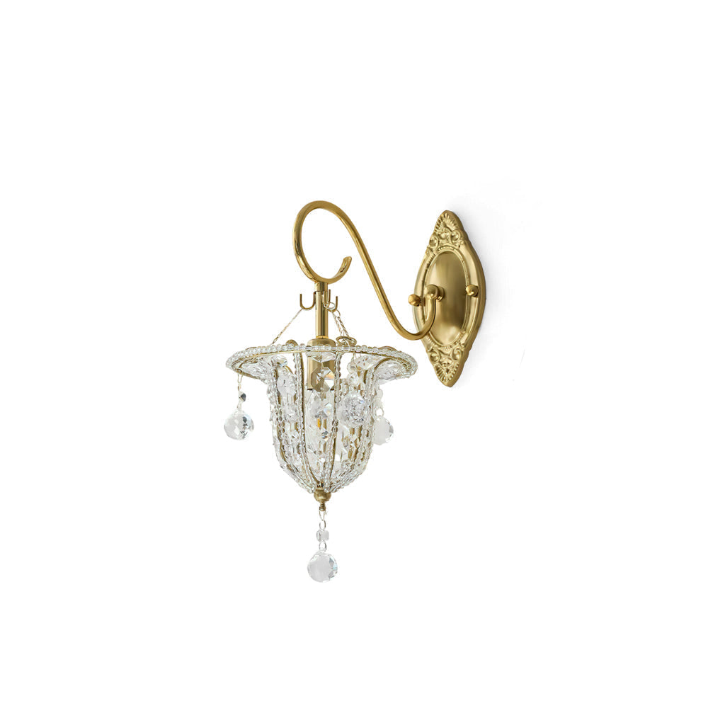 Eilers Wall Light with gold metalwork and crystal accents against a neutral wall.