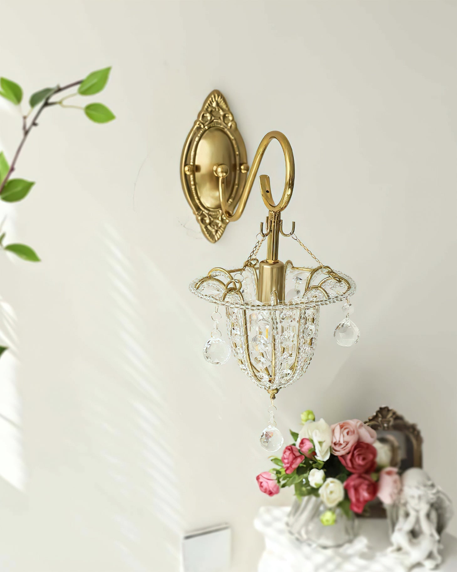 Eilers Wall Light illuminated, casting a warm, sparkling glow in a room.