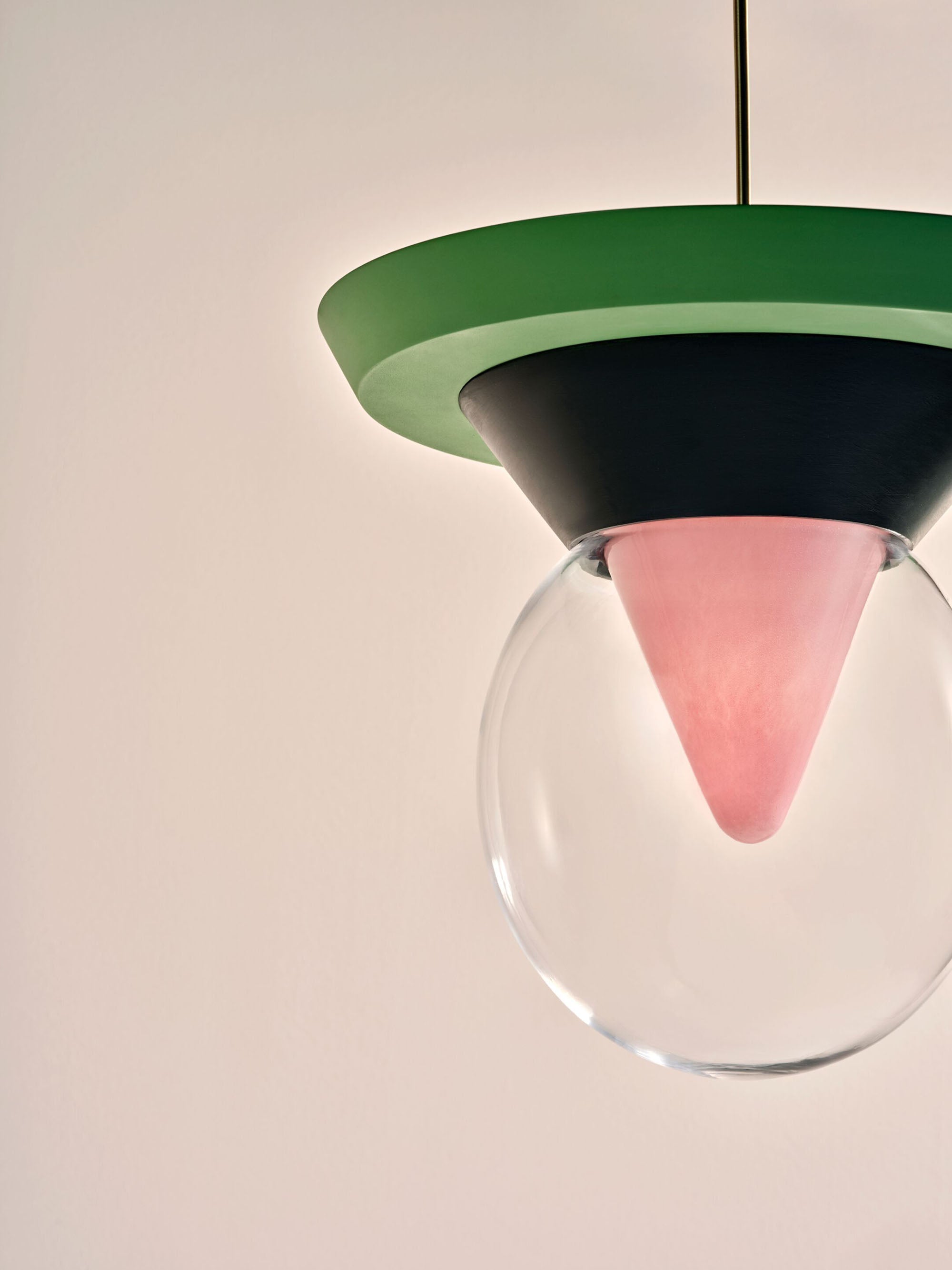 The Eirene lamp casting a soft, protective glow in a dim corner.