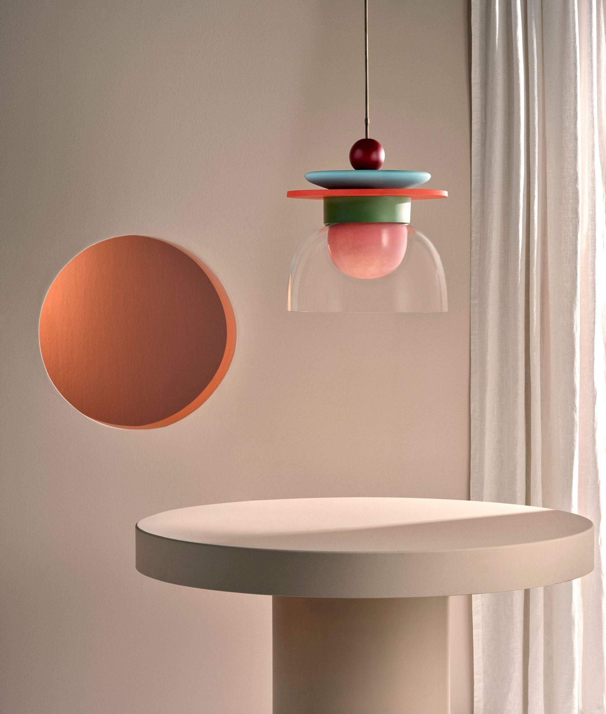 Multiple Eirene Pendant Lamps in various colors hung together.