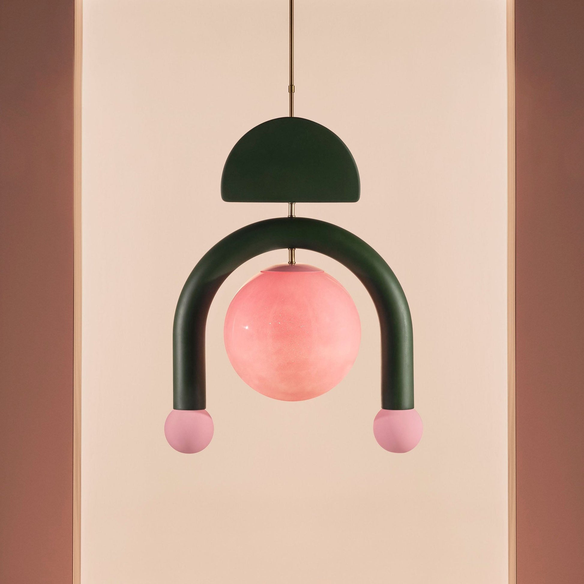The Red Eirene lamp against a neutral wall.