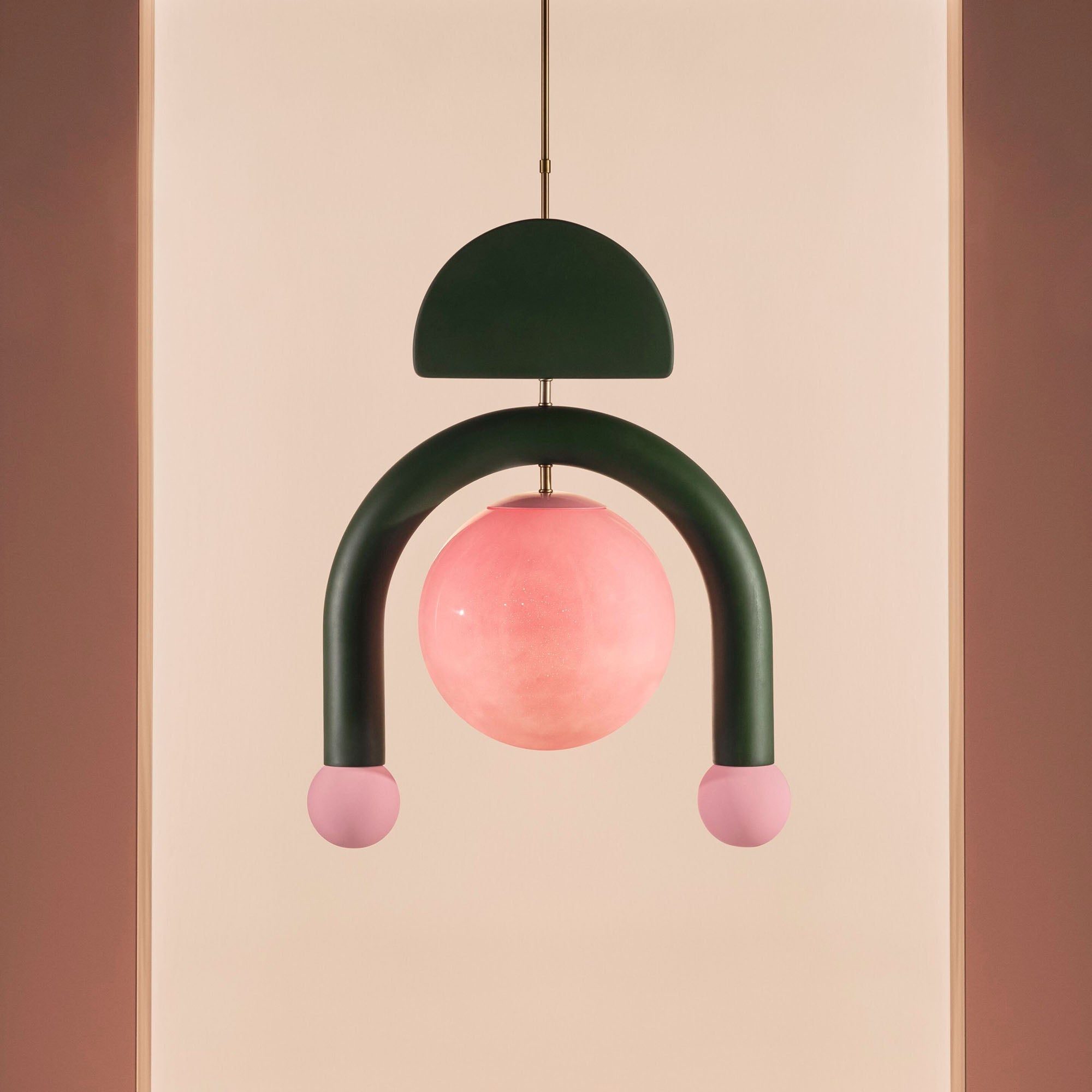 The Red Eirene lamp against a neutral wall.