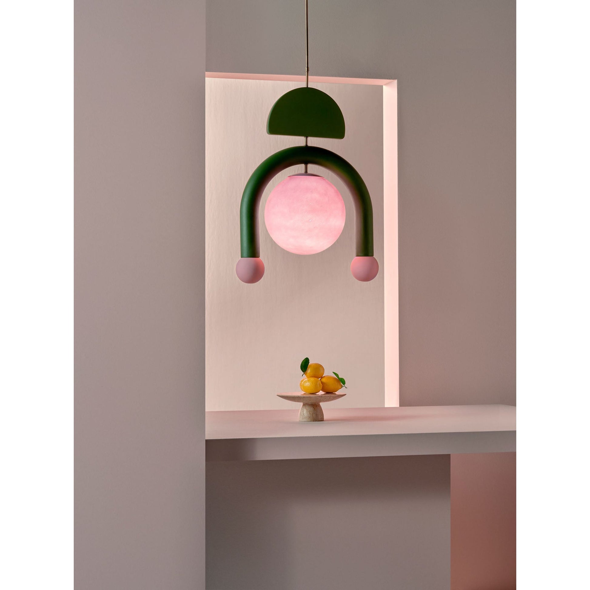 The Pink Eirene lamp adding a pop of color to a room.