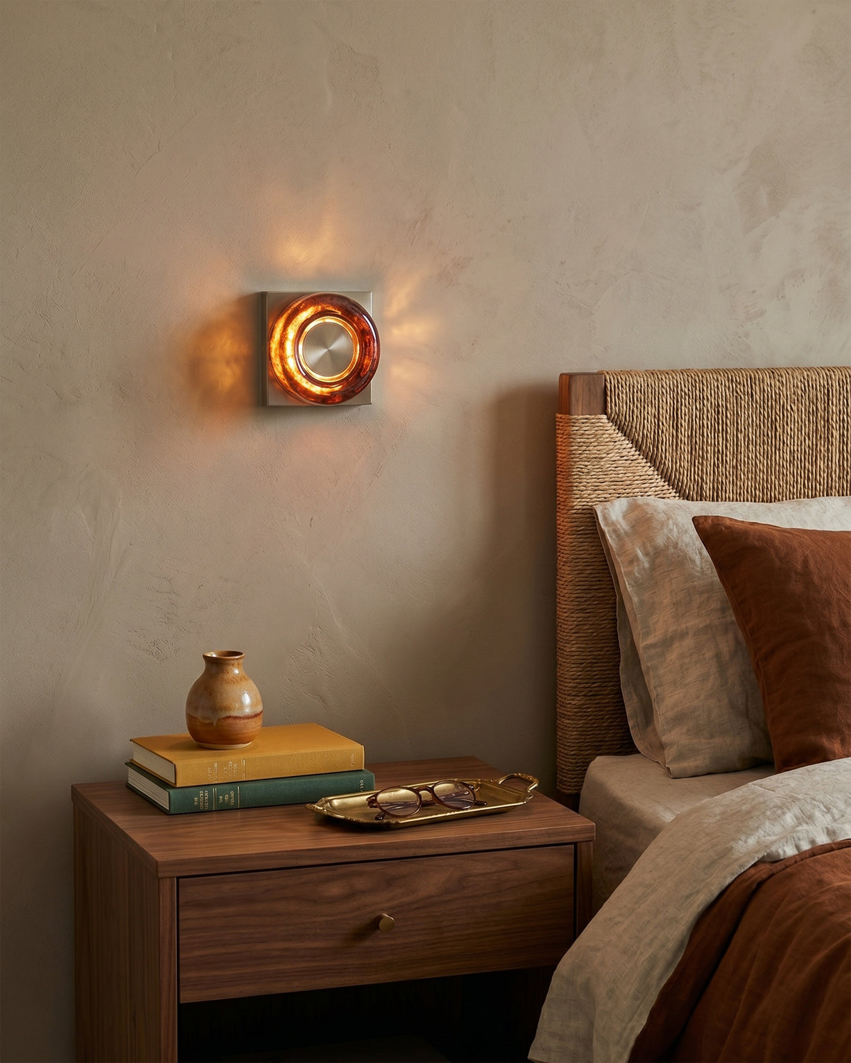 Front view of the circular Eisner Wall Sconce in red.