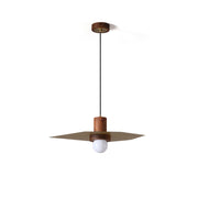 Elara Pendant Lamp with wood base and flat brass shade against a plain background.