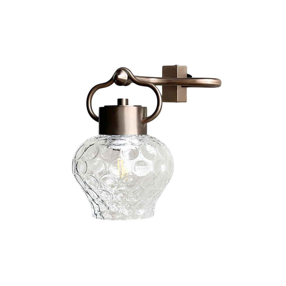 Eldorado Wall Lamp in bronze finish with a clear glass shade.