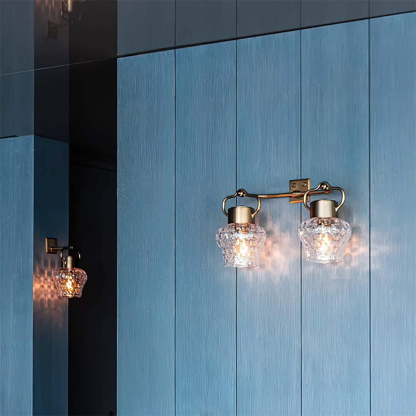Eldorado Wall Lamp providing soft, ambient light in a modern living room setting.
