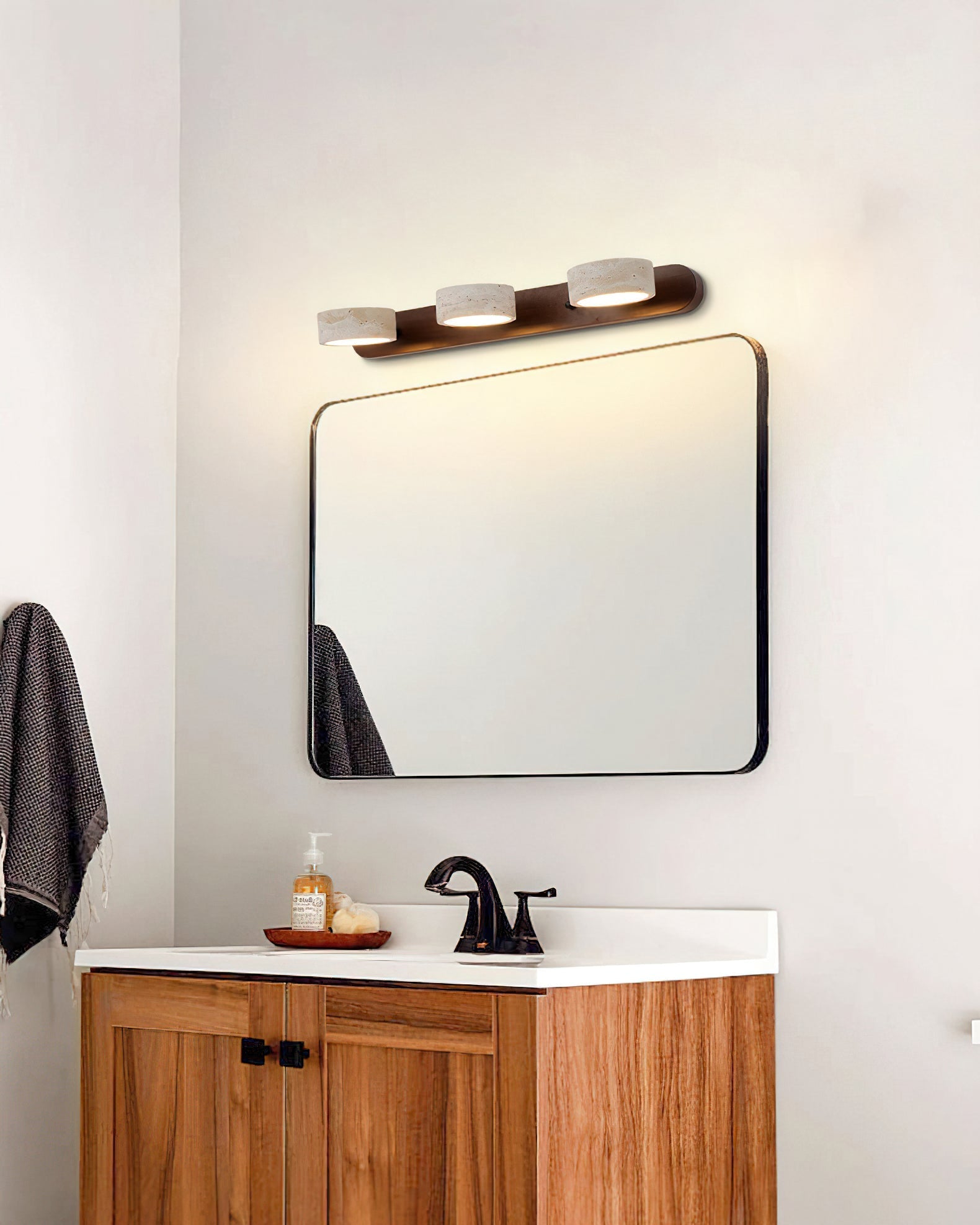 Elias Travertine Wall Lamp in the Wood color finish.