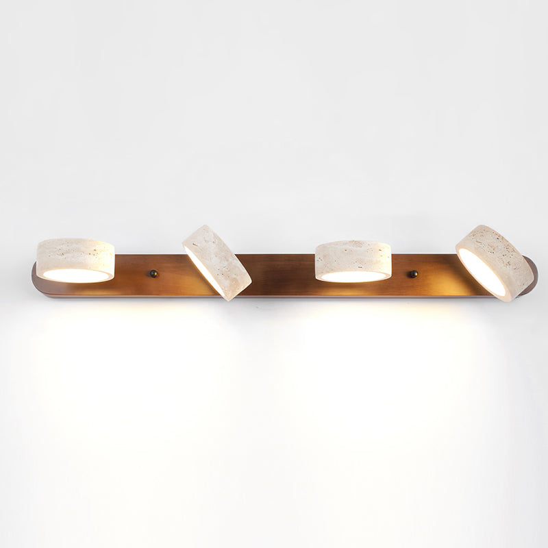 Elias Travertine Wall Lamp with warm kelvin light.