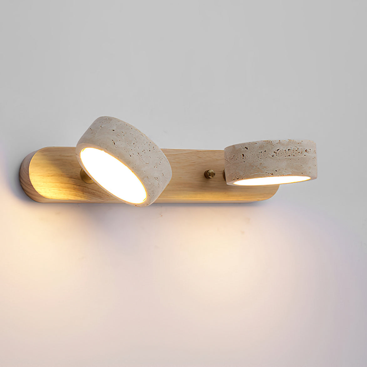 Angled view of the Elias Travertine Wall Lamp showing its linear form.