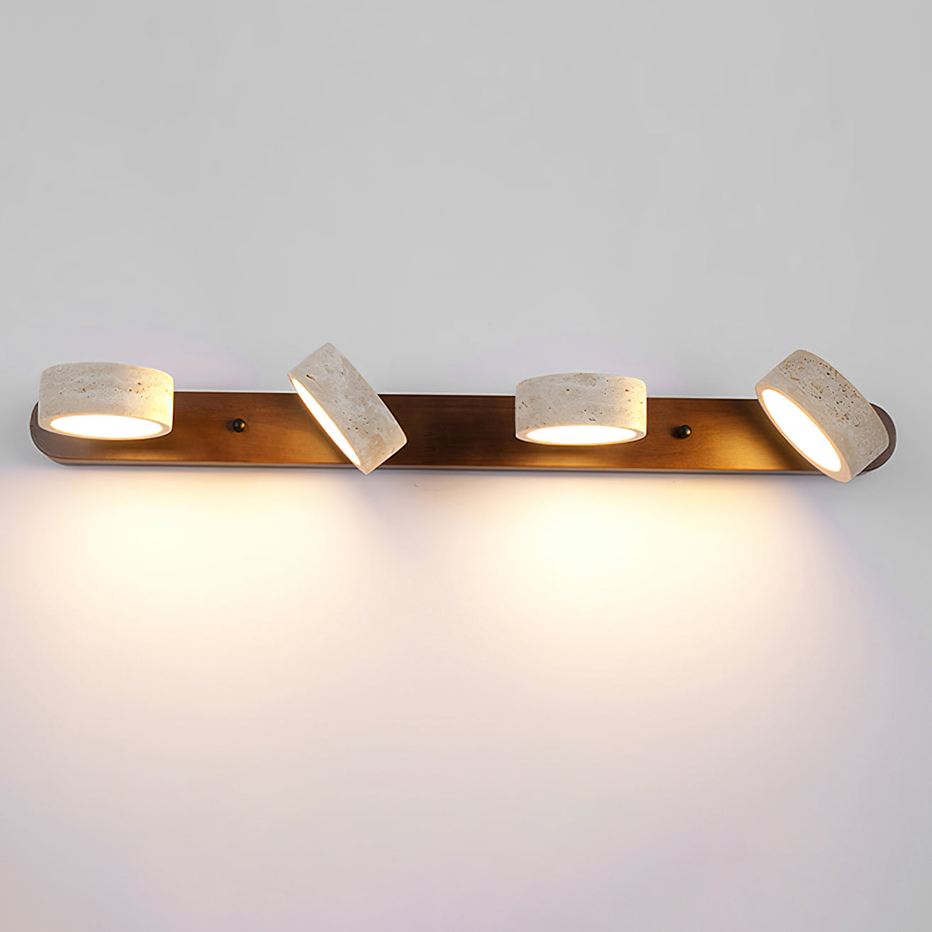 Elias Wall Lamp casting a soft, warm light.