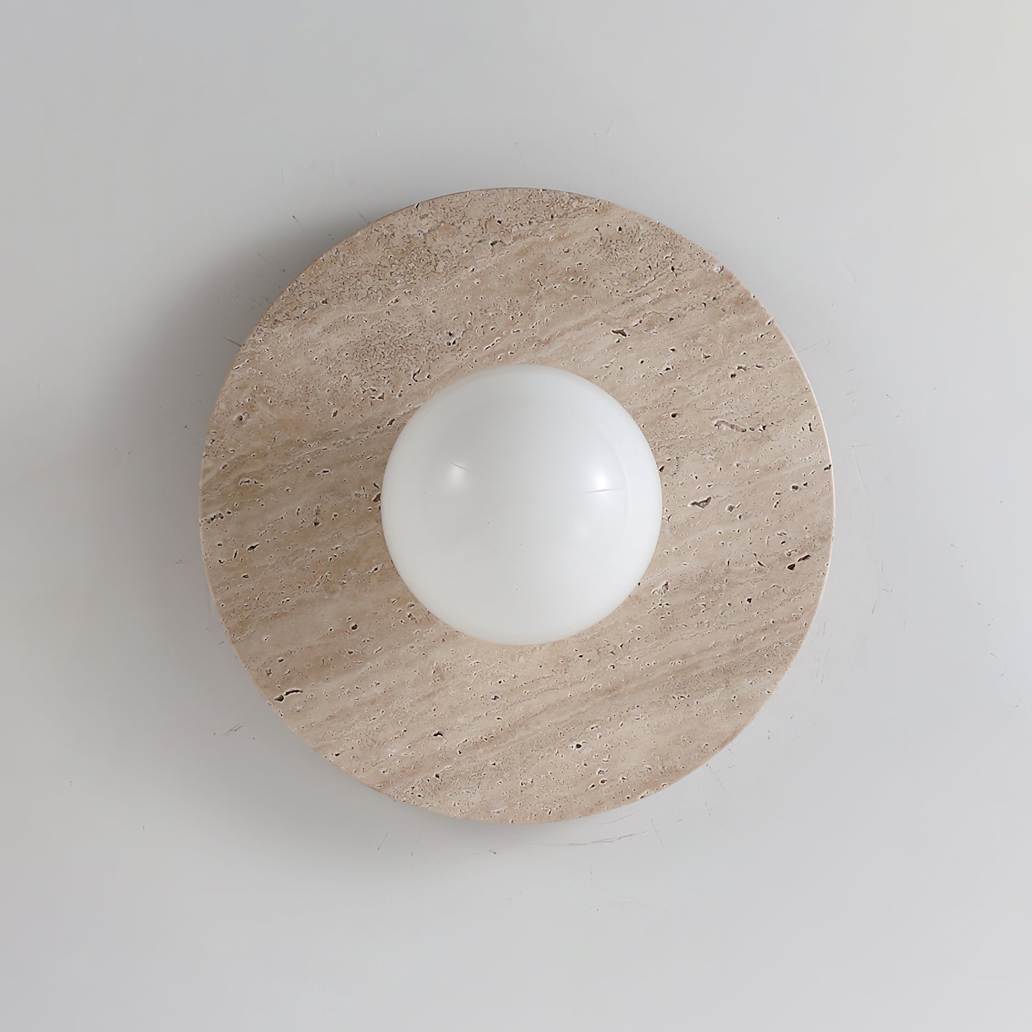 Unlit Elira Travertine Wall Lamp against a neutral background.