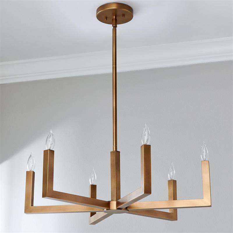 The Eliza Chandelier illuminating a modern living room.