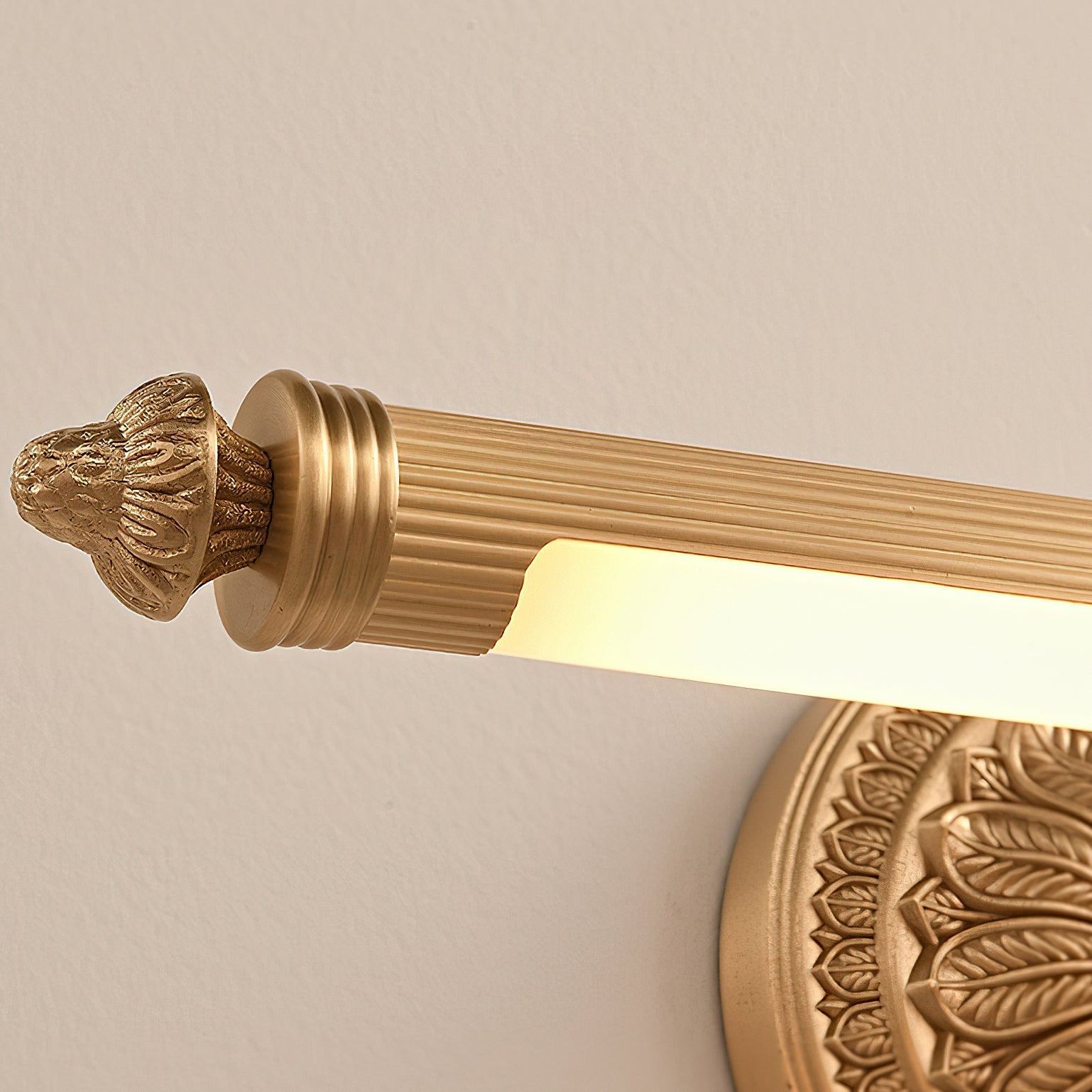 Another angle of the Ellesmere brass wall sconce against a dark wall.