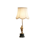 Ellie Table Lamp with brass body and white fabric shade.