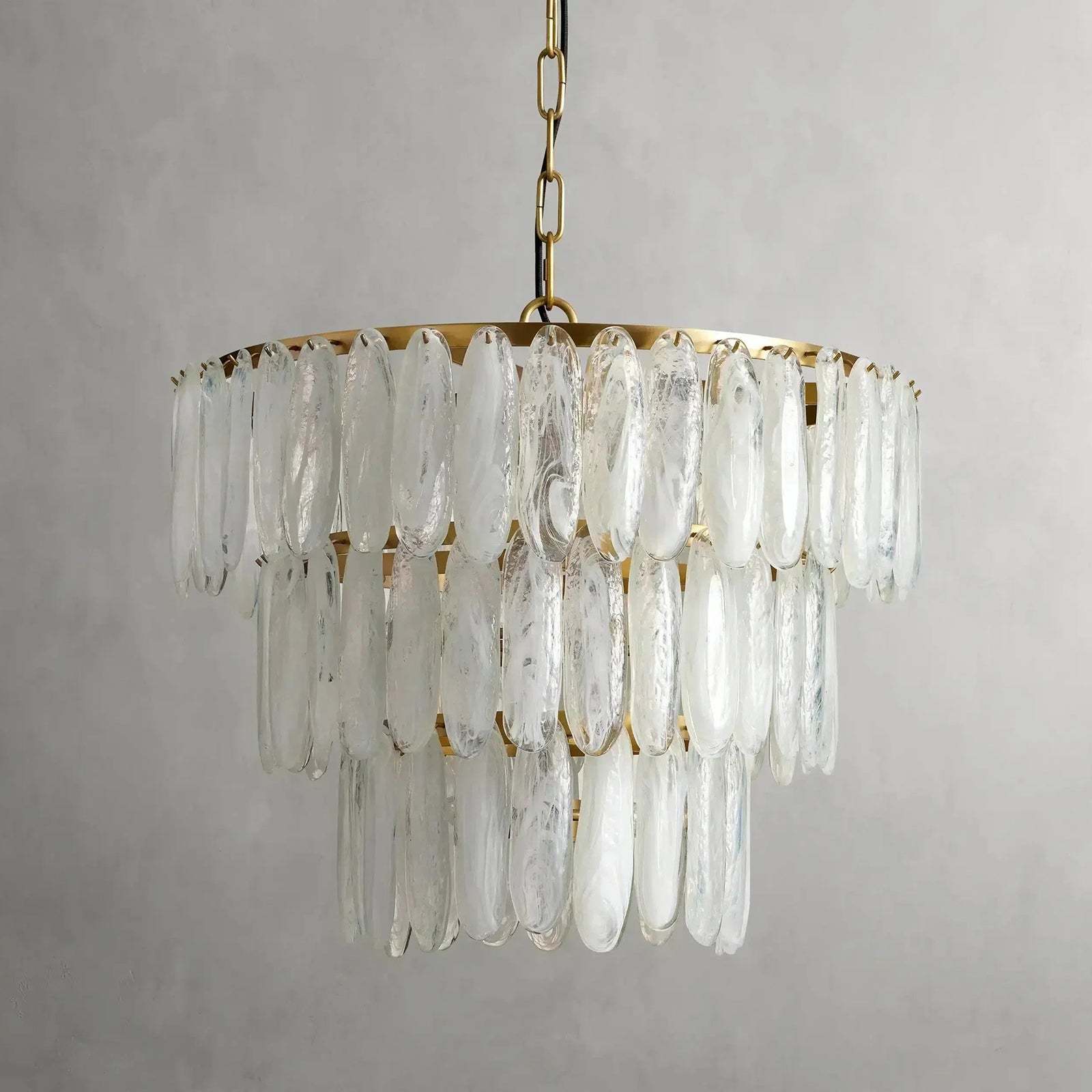 Lifestyle image of the Ellington Chandelier providing warm, diffused light.