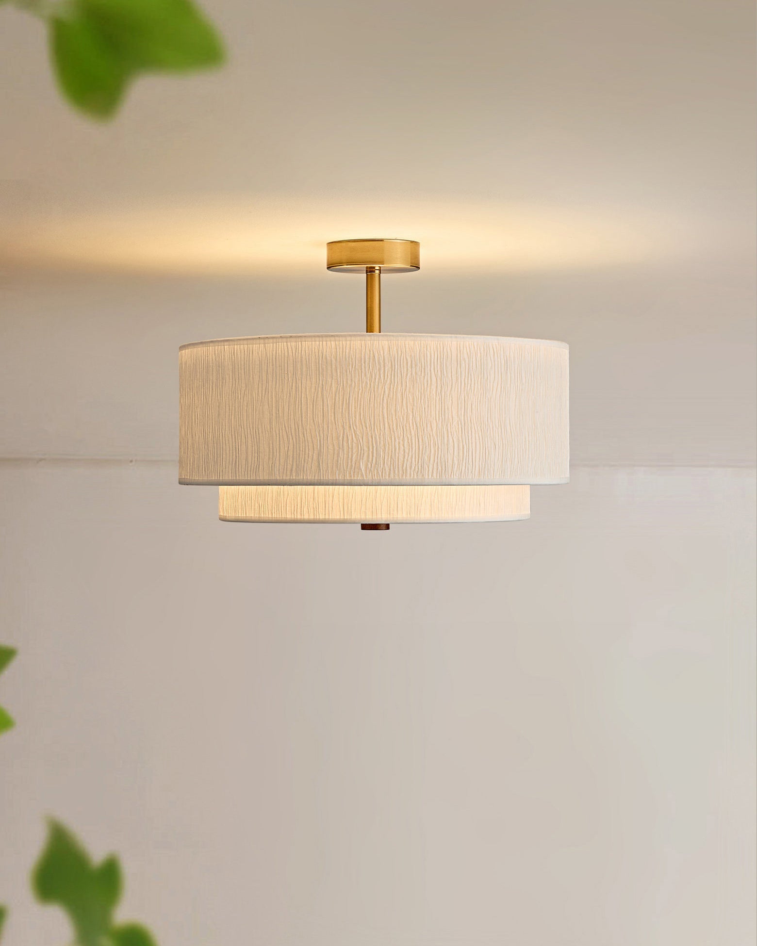 The light fixture installed in a Japandi-style bedroom.