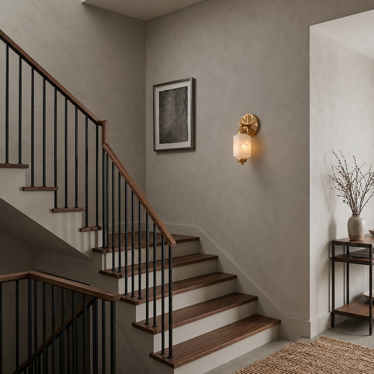 The wall sconce used as a bedside light next to a bed.