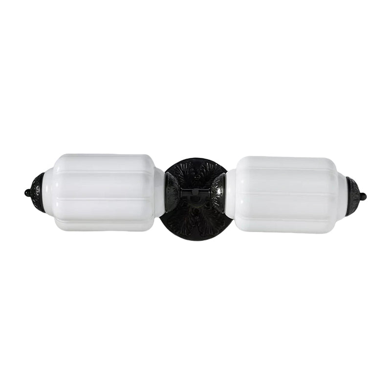 The Eloise Sconce in black finish against a light, neutral wall.