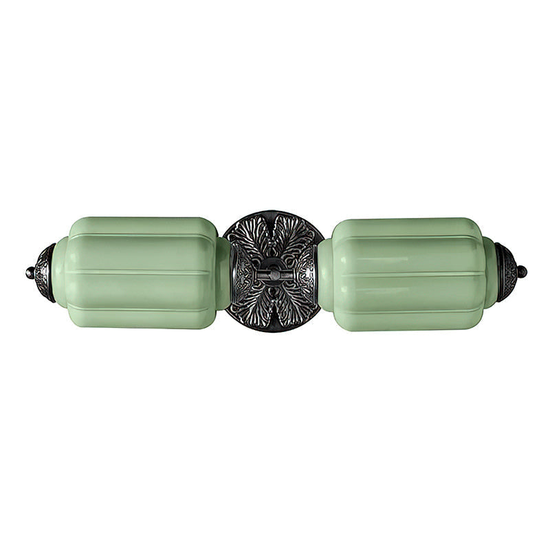 Detail of the two-head sconce in a vibrant green finish.