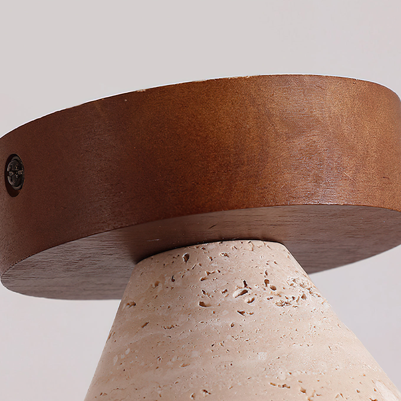 Detail of the wood top and travertine shade of the Emmet Ceiling Light.