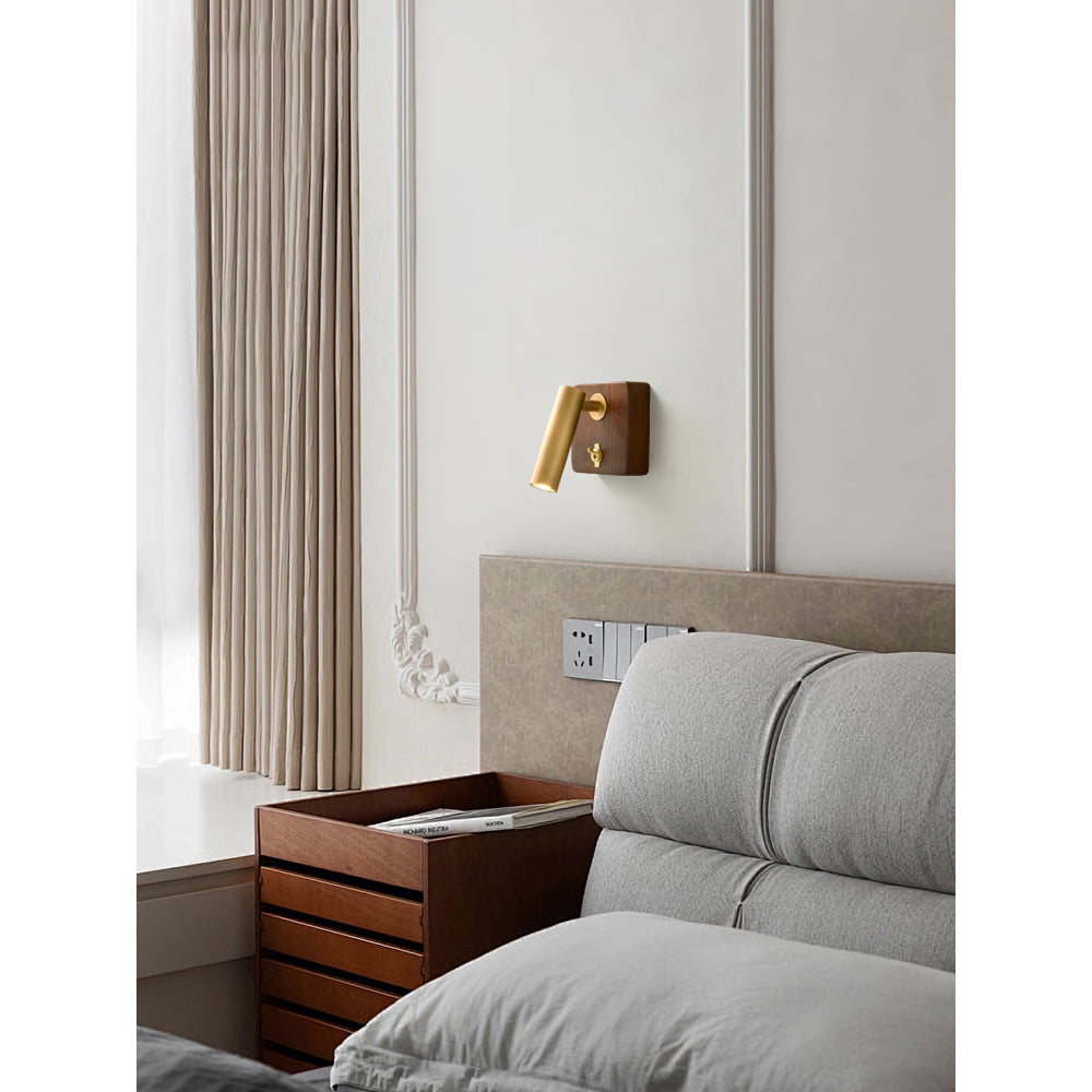 Enna Wall Lamp mounted horizontally above a headboard.