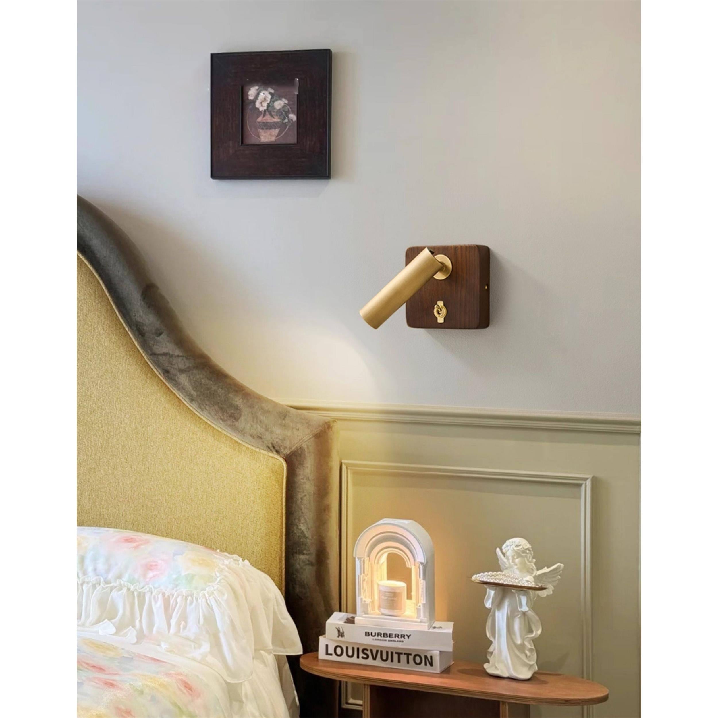 The adjustable head of the Enna Wall Lamp, directing light downwards.