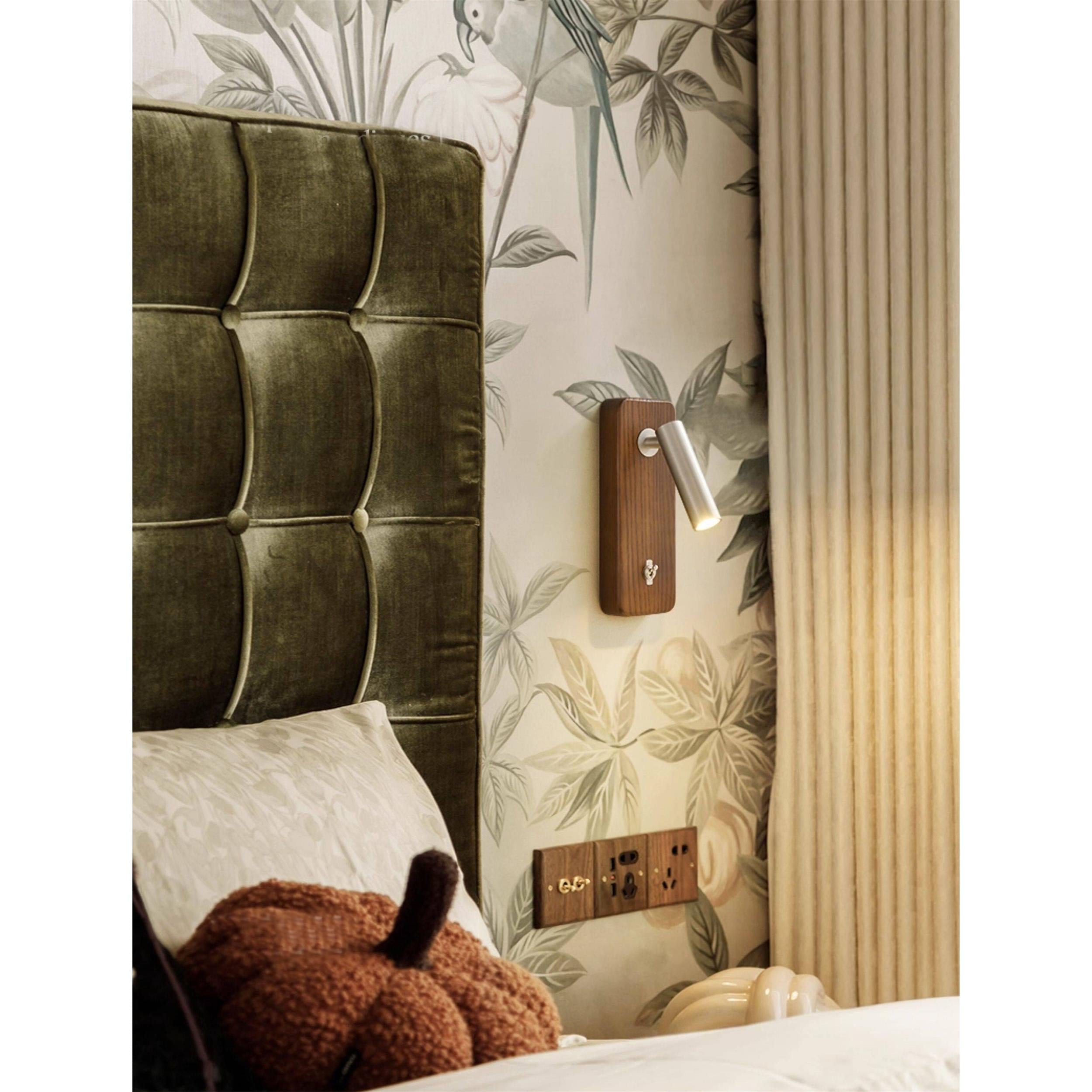 A pair of Enna Wall Lamps flanking a bed.
