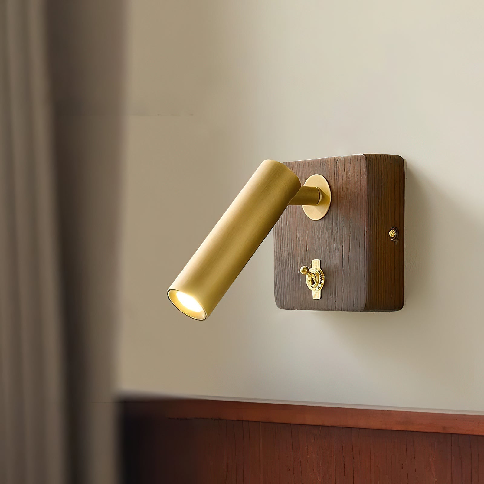 Close-up of the Enna Wall Lamp's brass lampshade.