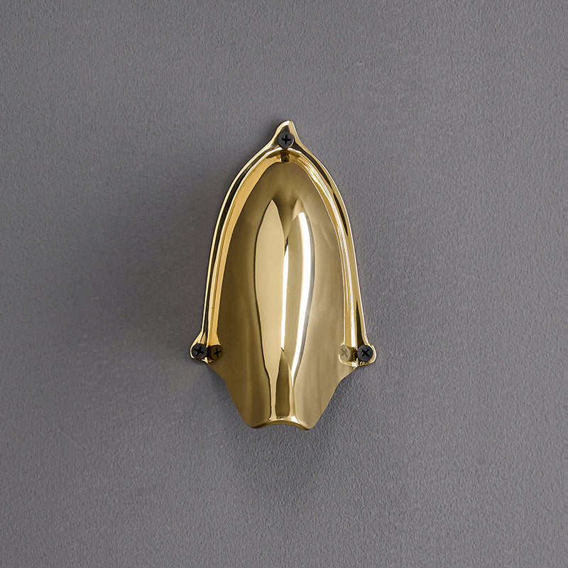 The half-dome shape of the Enoki Wall Lamp highlighted.