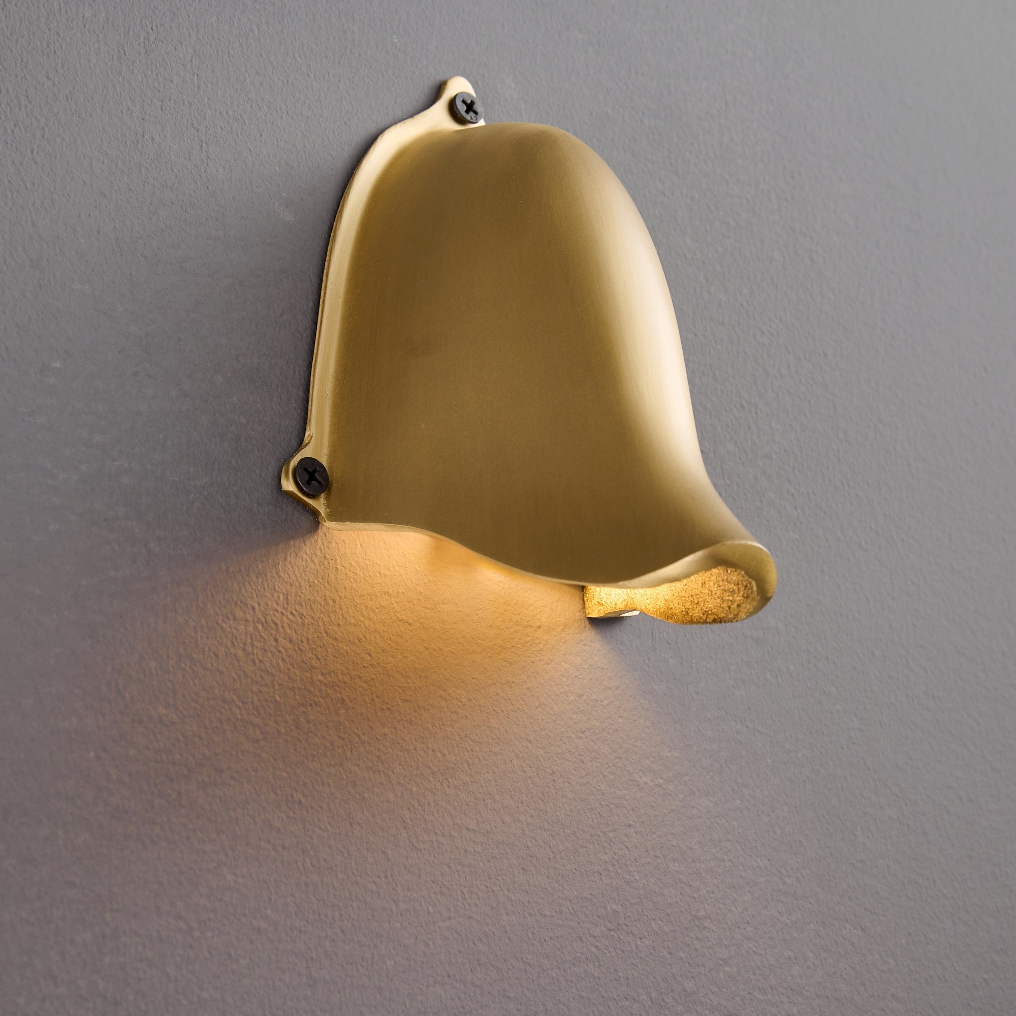 Close-up on the mounting plate of the Enoki Wall Lamp.