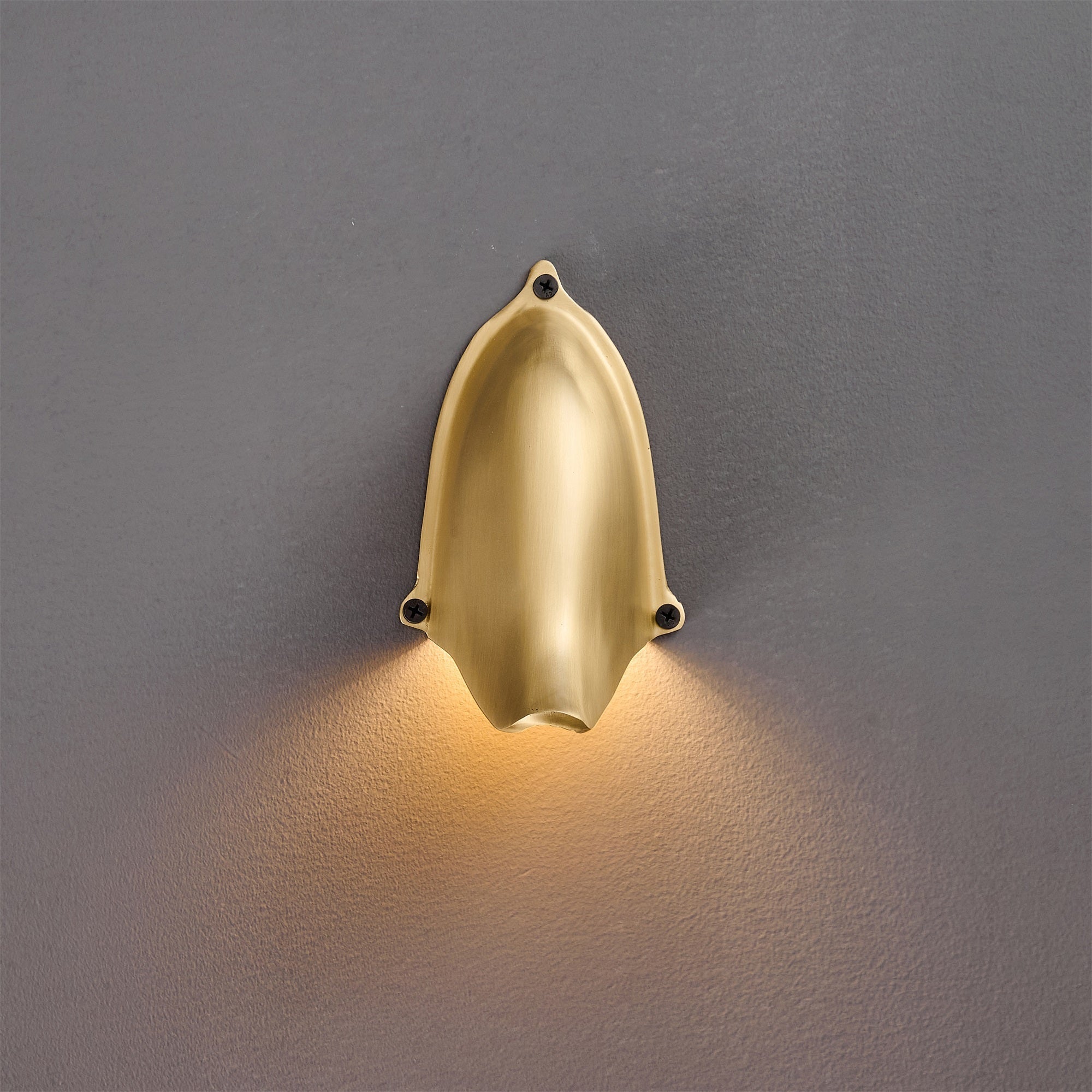 The Enoki Wall Lamp in a bedroom setting.
