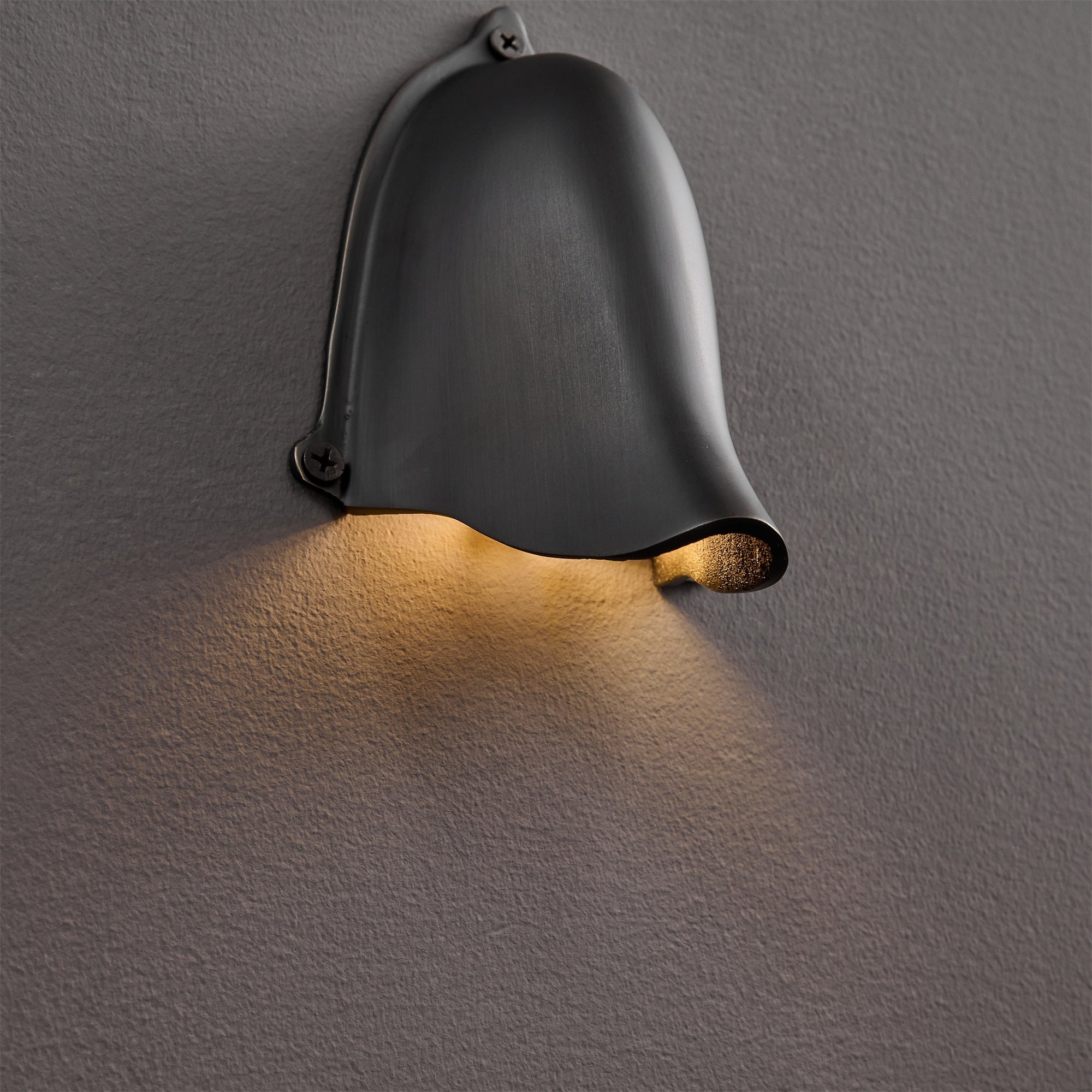 Artistic shot of the Enoki Wall Lamp's silhouette.