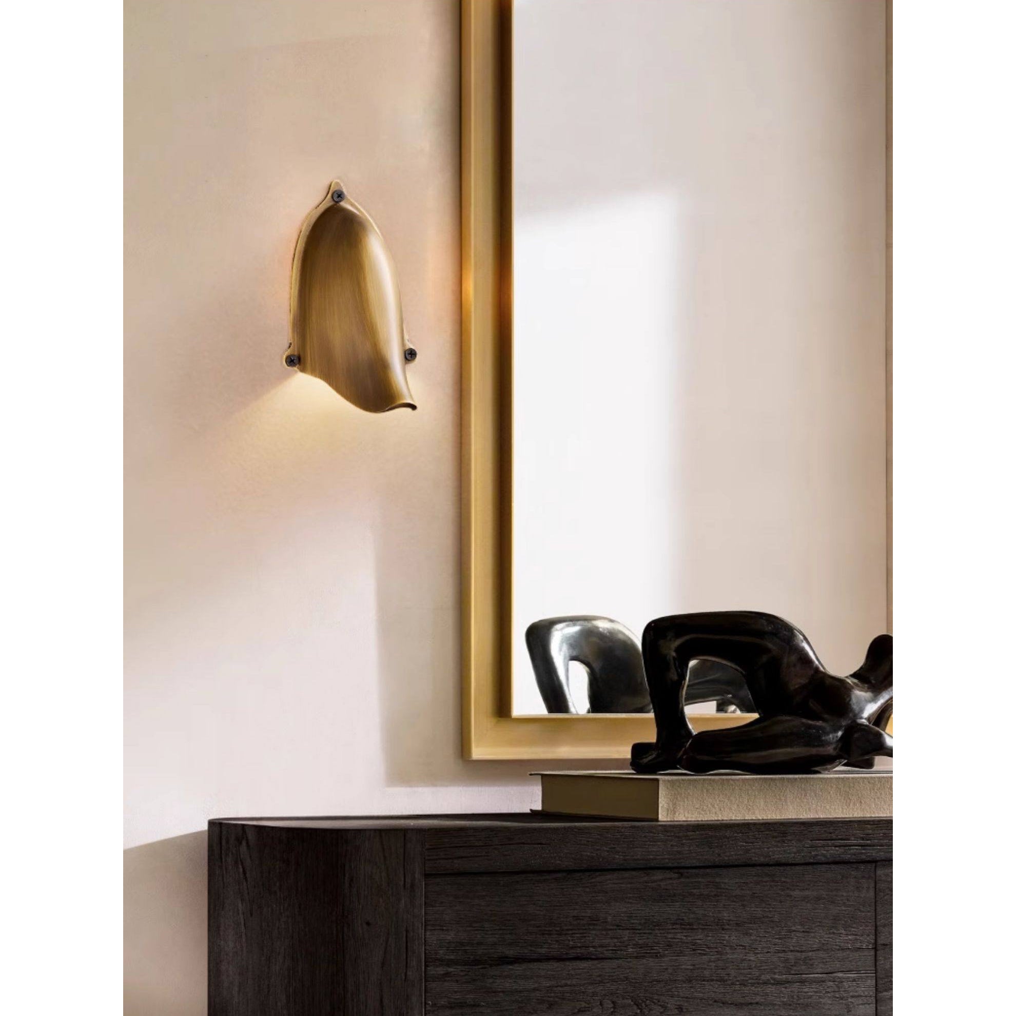 Lifestyle view of the Enoki Wall Lamp in a modern hallway.