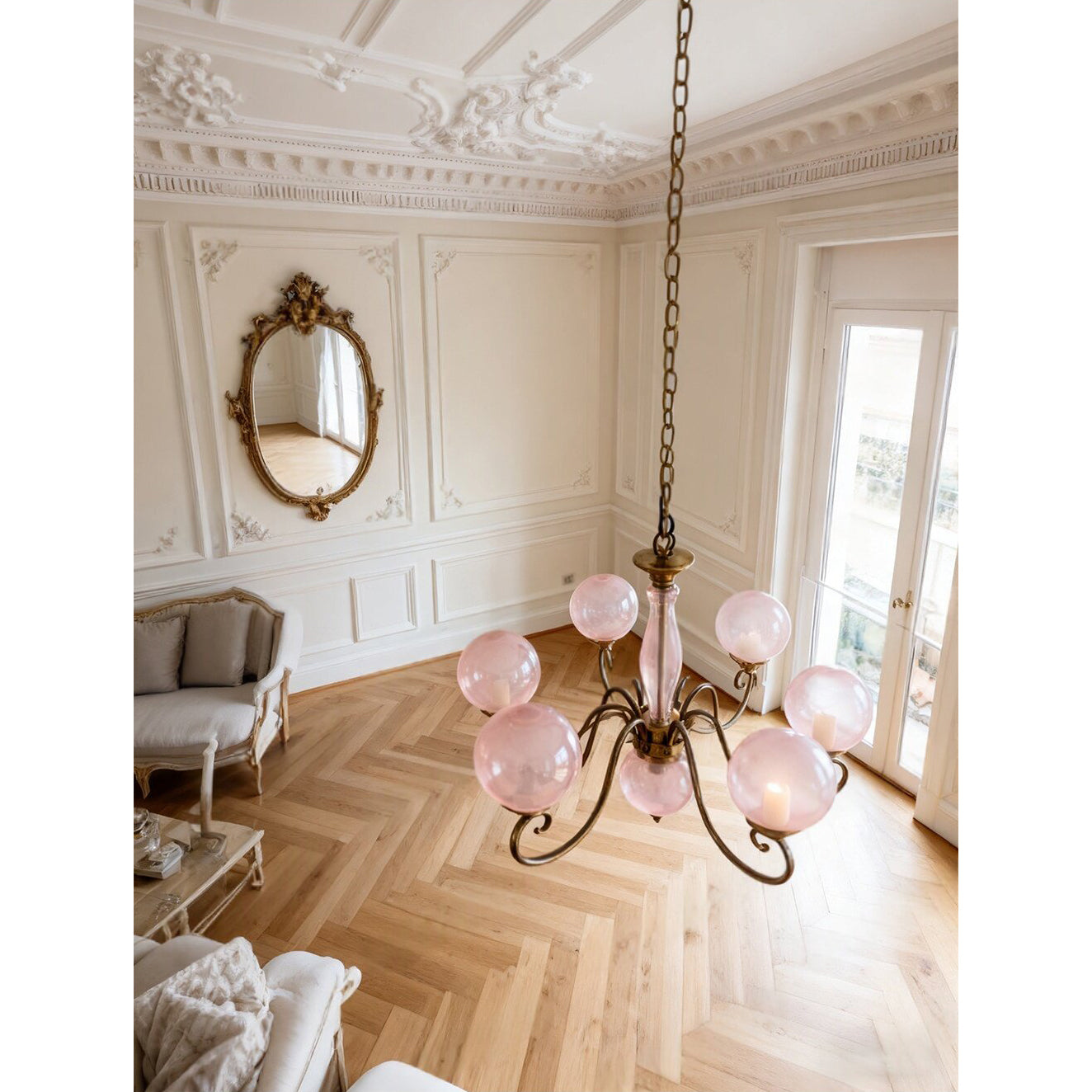 Side profile of the Evelyn Chandelier with white globes.