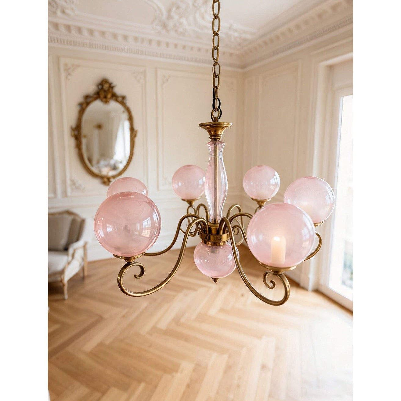 Side profile of the Evelyn Chandelier with blush pink globes.
