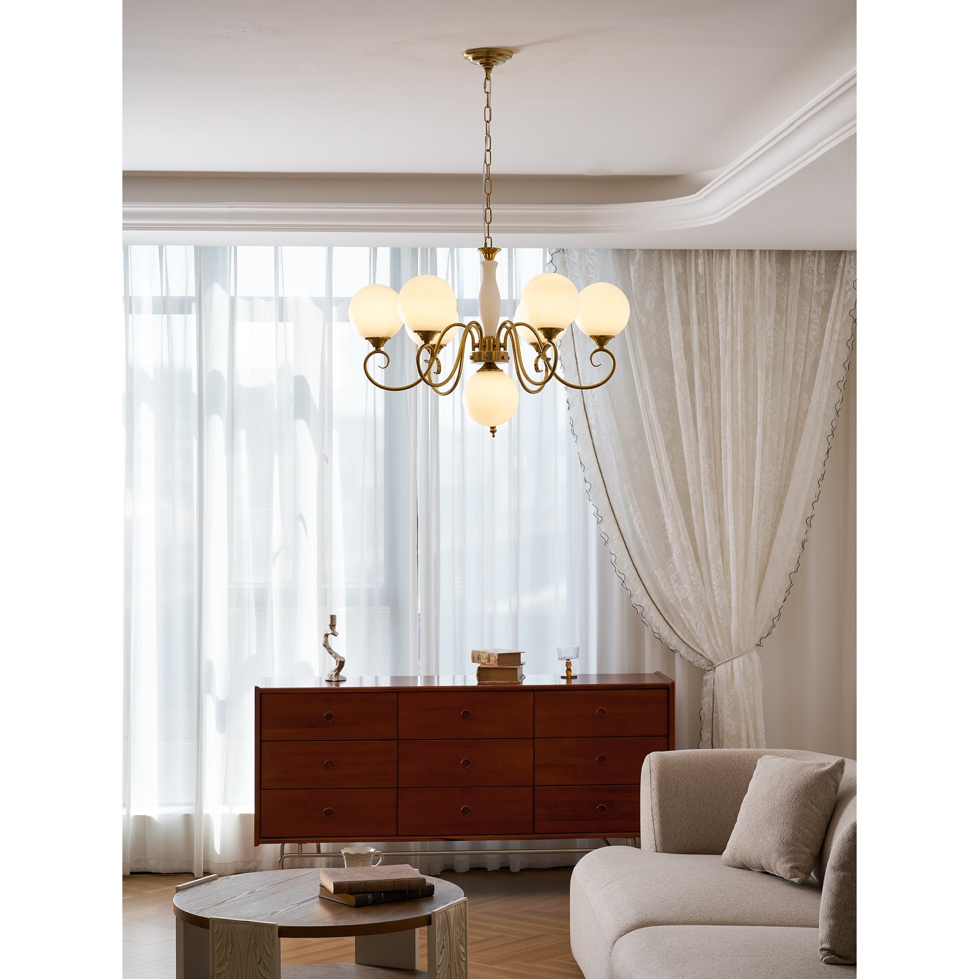 Evelyn Glass Chandelier with clear globes, illuminated.