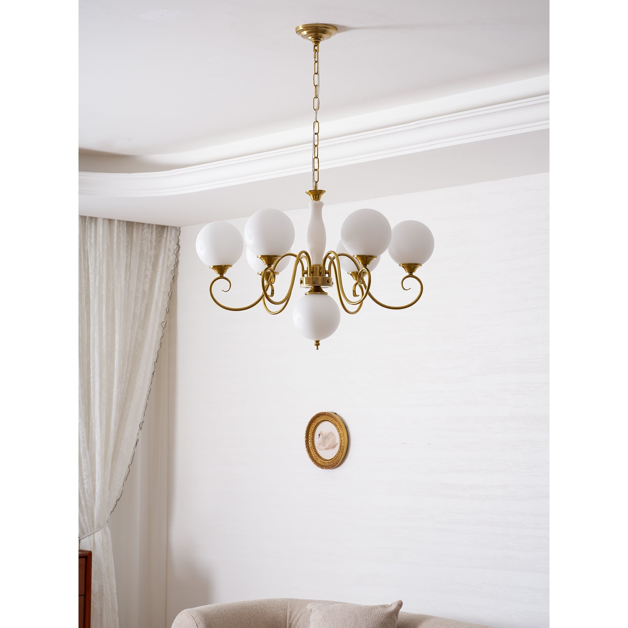 The chandelier's reflection in a mirror.